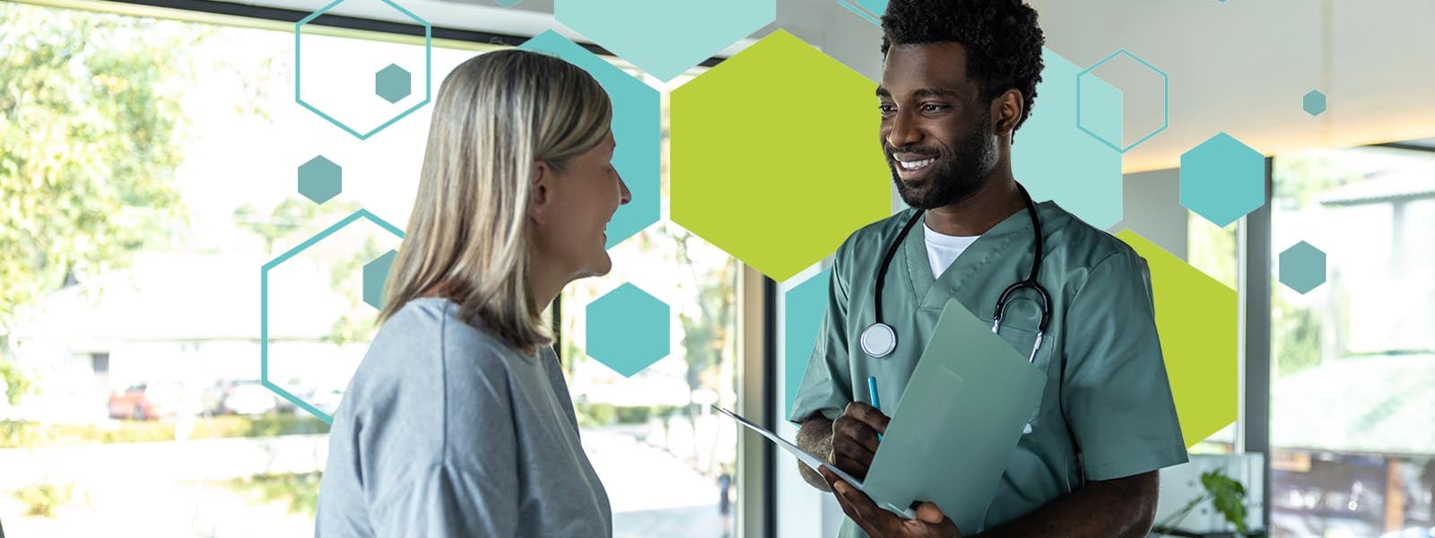 A smiling healthcare provider speaking with a patient in a bright clinic, symbolizing trust and connection in rural healthcare.