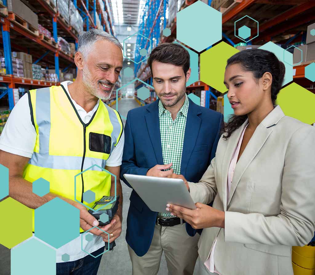 Warehouse managers discussing with tablet