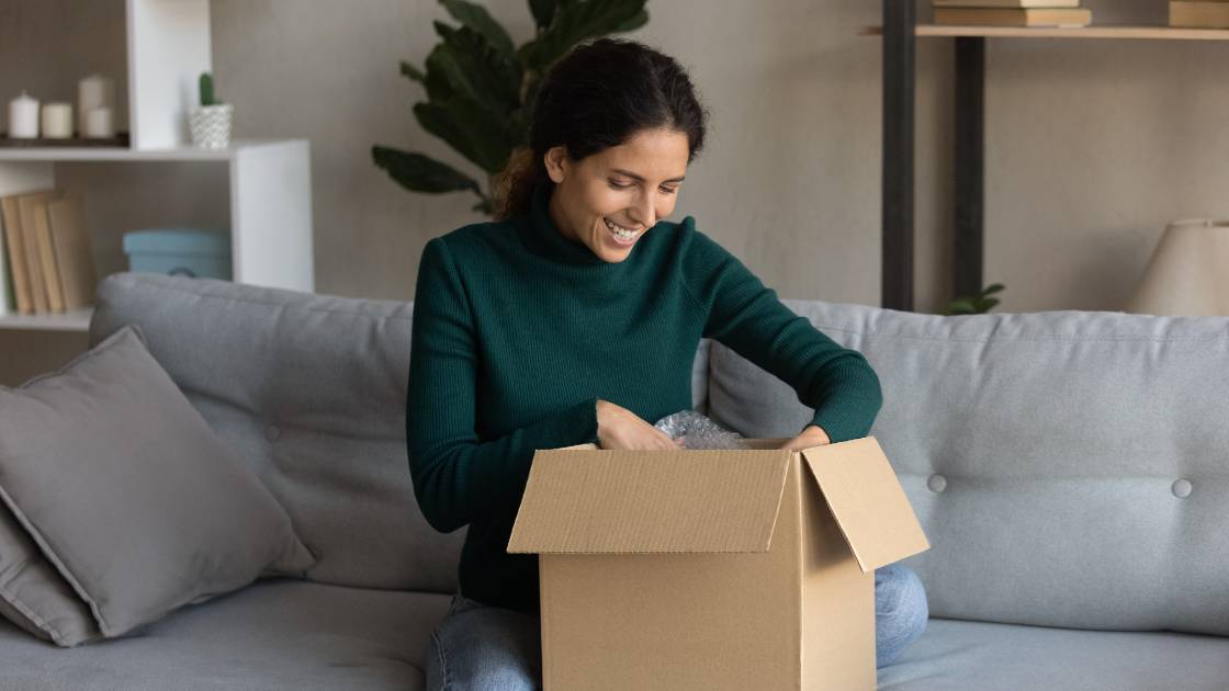 Woman opening box