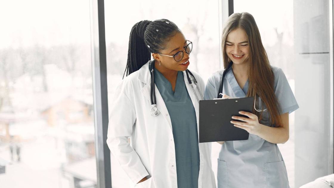 nurses looking at clipboard