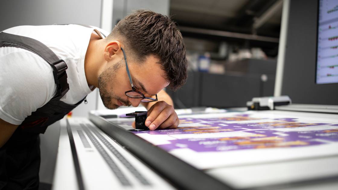 Professional printer inspecting product
