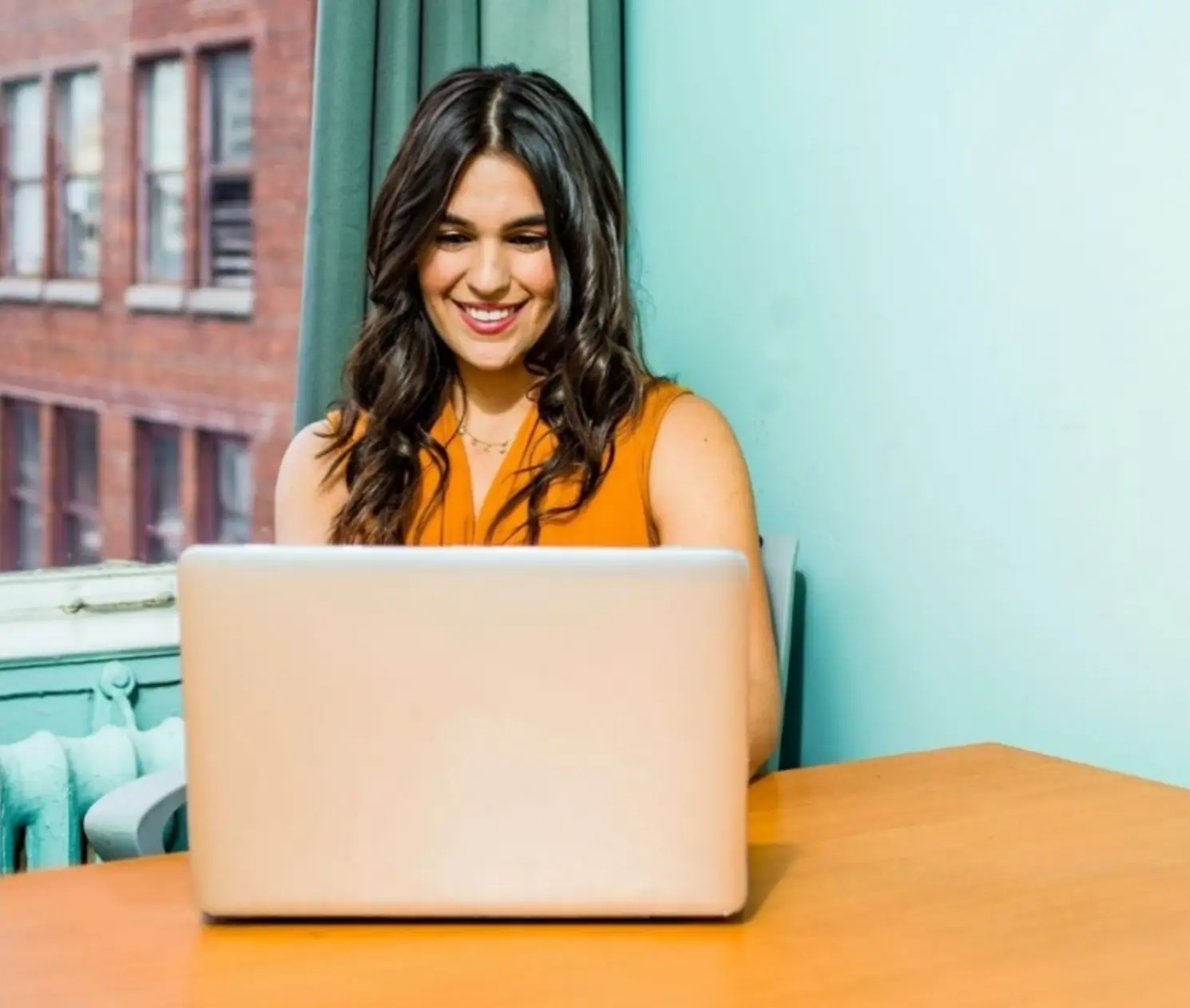 woman-using-laptop-in-blue-room